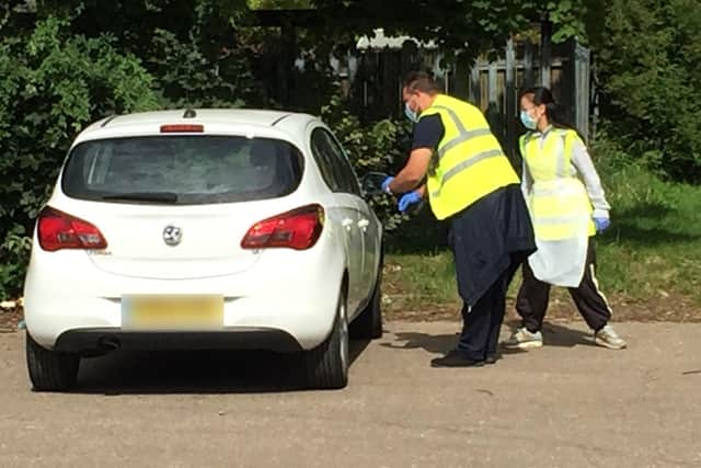 People arrive for testing at the site