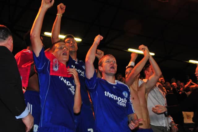 Posh players celebrate their play-off semi-final win over MK Dons at London Road.