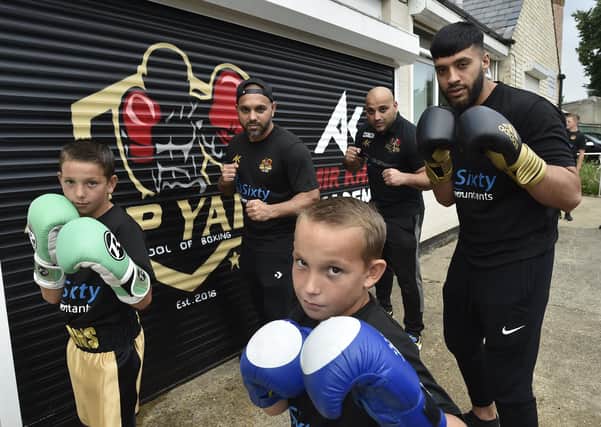 Bilal and Hamad Javed with boxers  Santina Harris, John Terry and  Raja Malak  at the Top Yard School of Boxing  at Cromwell Road. Photo: David Lowndes.