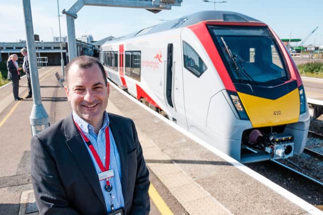 Greater Anglia Managing Director, Jamie Burles, with a new Stadler bimode train at Lowestoft earlier this year. EMN-200730-112413001
