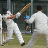 Josh Smith hits out during his innings of 106 for Peterborough Town against Desborough. Photo: David Lowndes.