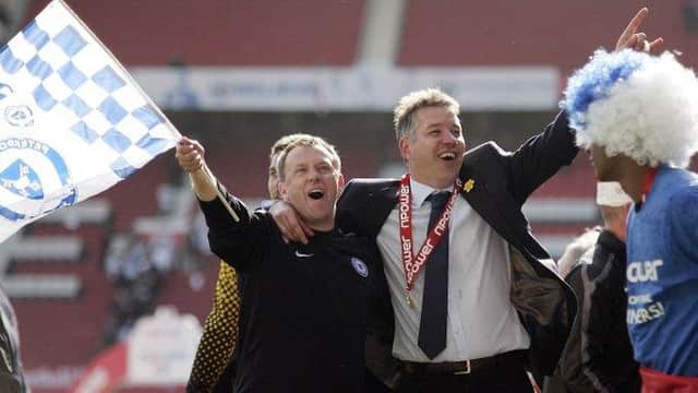 Mark Robson (left) and Darren Ferguson celebrate a Posh promotion at Old Trafford in 2011.