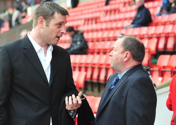 Posh chairman Darragh MacAnthony with manager Gary Johnson in 2011.