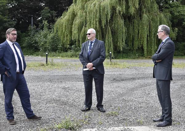 Mayor James Palmer, John Holdich and  Professor Roderick Watkins (Vice Chancellor of Anglia Ruskin Peterborough) on the site of the new university on the city's  Embankment.