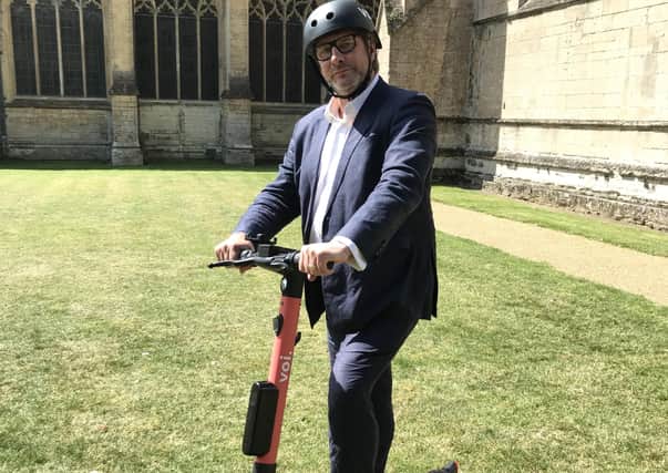 Mayor James Palmer tries out an E-scooter.