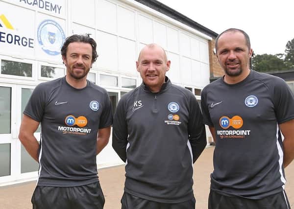 Posh Academy manager Kieran Scarff (centre) with the under 18 management team of Simon Davies (left) and Matthew Etherington (right).