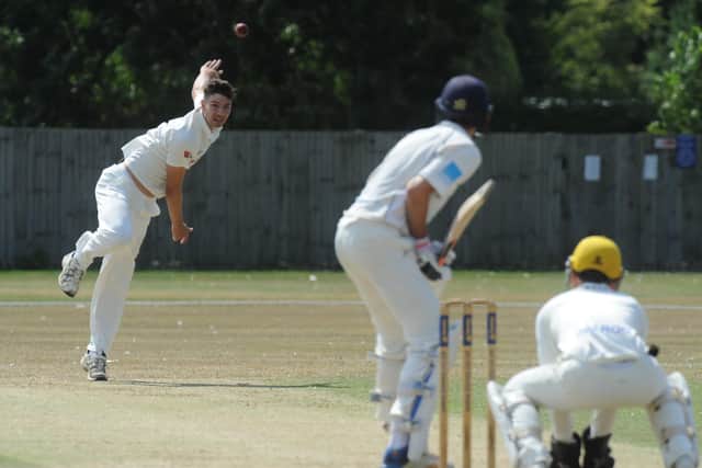 Josh Smith bowling for Peterborough Town against ONs. Photo: David Lowndes.