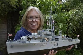 Julie Gibbs with the model of HMS  Pheasant made by her father former Able Seaman Bernard Dowding.