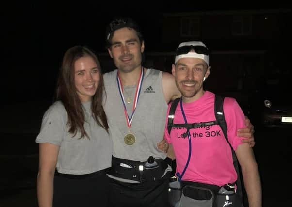 Peter with girlfriend Polly, who accompanied him on the swim and friend Tom who joined him on the marathon leg.