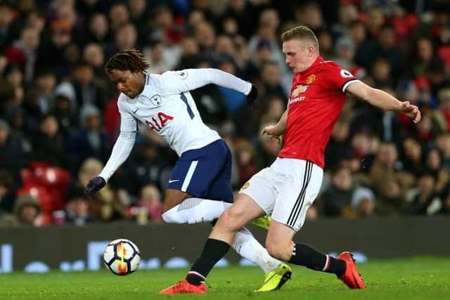 Ethan Hamilton (red) playing for Manchester United against Spurs in a Premier 2 match. Photo: Getty Images.