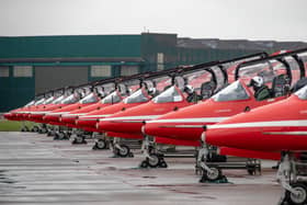 Image shows The Royal Air Force Aerobatic Team (The Red Arrows) preparing for departure from their home base of RAF Scampton in Lincolnshire. The team consists of 11 pilots, nine of whom fly in the display, and more than 100 support personnel and technicians.