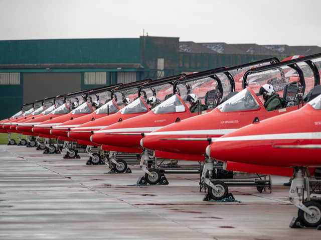 Image shows The Royal Air Force Aerobatic Team (The Red Arrows) preparing for departure from their home base of RAF Scampton in Lincolnshire. The team consists of 11 pilots, nine of whom fly in the display, and more than 100 support personnel and technicians.