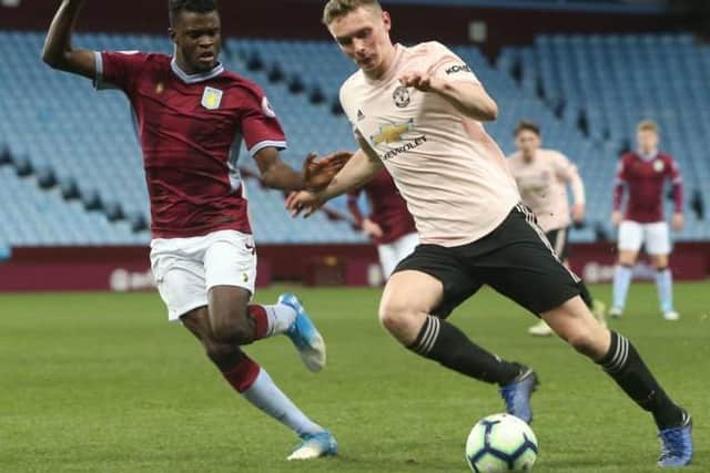 Ethan Hamilton (right) in action for Manchester United Under 23s.