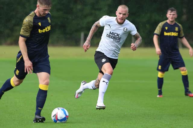 Joe Ward (white shirt) in action for Posh against Stoke City at St George's Park. Photo: Joe Dent/theposh.com.