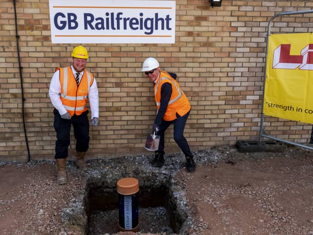 Burying the time capsule at Peterborough GB Rail Freioght depot in Maskew Avenue.