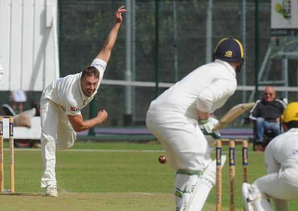 Jamie Smith bowling for Peterborough Town against Finedon last weekend. Photo: David Lowndes.