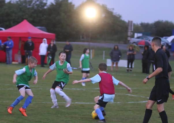 Football. action from the first match played under the new protable floodlights in Whittlesey. Photo: RWT Photography.