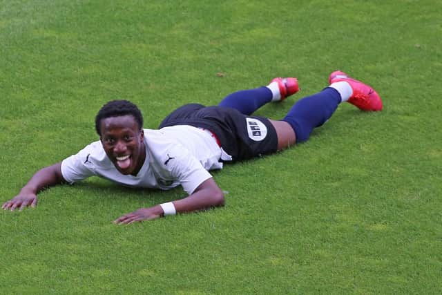 Siriki Dembele celebrates his goal for Posh at Colchester. Photo: Joe Dent/theposh.com.