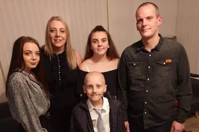 Georgy with his mum, Helen, dad, Richard and two sisters