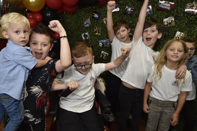 George Elliott, the Voice Kids finalist, at a finals party at the Post Office Club, Bourges Boulevard with friends and his cousin Blake Carter.