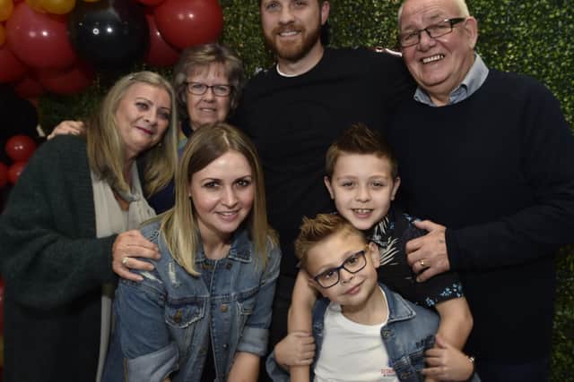 George Elliott, the Voice Kids finalist, with his proud family at a finals party at the Post Office Club, Bourges Boulevard.