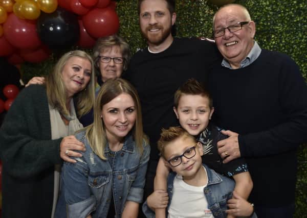 George Elliott, the Voice Kids finalist, with his proud family at a finals party at the Post Office Club, Bourges Boulevard.