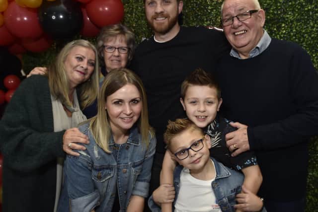 George with his family.