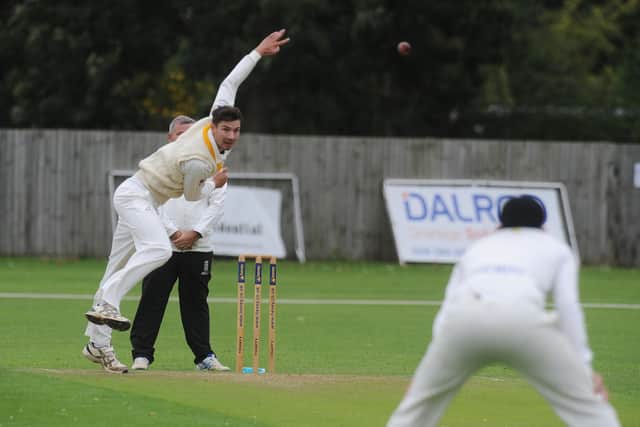 Josh Smith bowling for Peterborough Town against Geddington. Photo: David Lowndes.