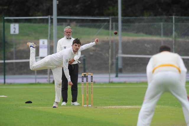 Lewis Bruce on his way to 4-15 for Peterborough Town against Geddington.  Photo: David Lowndes.