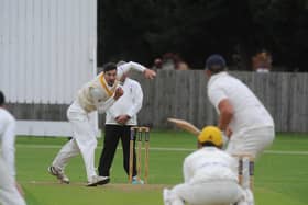 Josh Smith bowling for Peterborough Town against Geddington last weekend. Photo: David Lowndes.