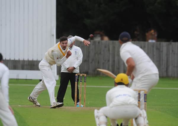 Josh Smith bowling for Peterborough Town against Geddington last weekend. Photo: David Lowndes.