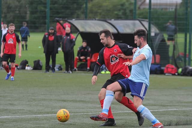 Zack Fisher (red) in action for Netherton United against Barley Mow. Photo: David Lowndes.