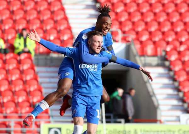 George Cooper celebrates a goal for Posh at Doncaster in February, 2019. Photo: Joe Dent/theposh.com.
