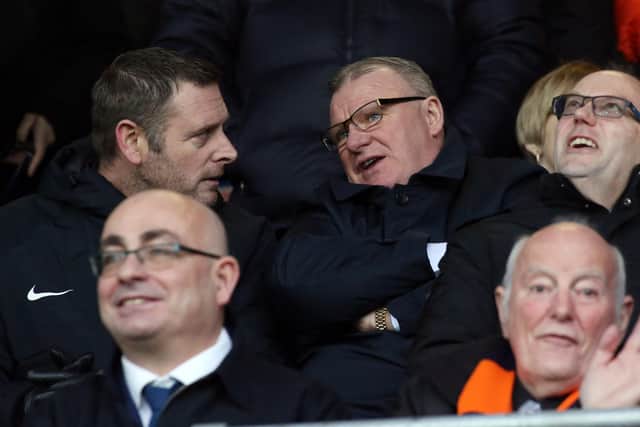 Darragh MacAnthony (left) and Steve Evans in the stands.