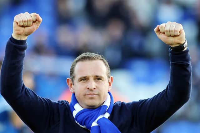 Peterborough United boss Dave Robertson celebrates a win over Leyton Orient.