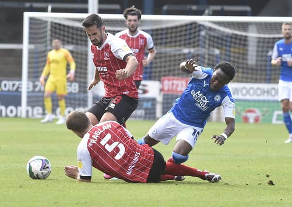 Posh man-of-the-match Siriki Dembele takes a tumble in the Carabao Cup defeat by Cheltenham. Photo: David Lowndes.