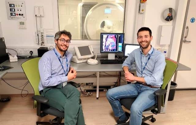 sychiatrist Dr Emanuele Osimo (left) with cardiologist Dr Antonio De Marvao in front of the 3T Magnetic Resonance Imaging (MRI) scanner used for the study in the Robert Steiner MR Unit (Medical Research Council London Institute for Medical Sciences and Imperial College London).