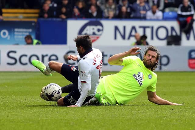 Michael Bostwick in tough-tackling action for Posh.