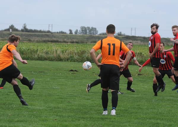 Leverington let fly from a free-kick during their Premier Division defeat at Cardea. Photo: David Lowndes.