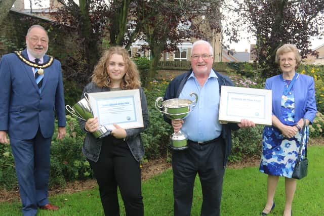 Ellie Nicholls and Phil Knighton receiving their awards from David and Ann Mason