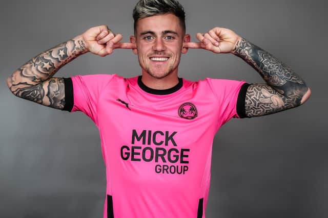 Sammie Szmodics models the new Posh away shirt which is available to buy from 10am on Wednesday. Photo: Joe Dent/theposh.com.