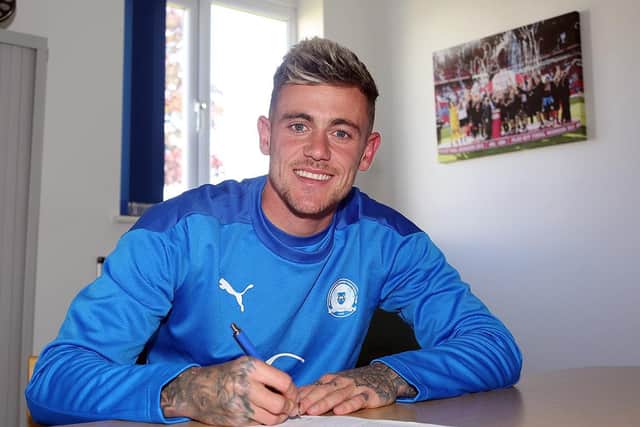 Sammie Szmodics signs for Posh. Photo: Joe Dent/theposh.com.
