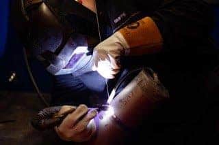 Apprentices at work at 
Stainless Metalcraft.

Picture by Terry Harris.