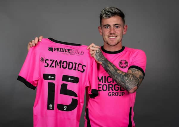Sammie Szmodics poses with the new Posh away shirt which went on sale on Wednesday morning.