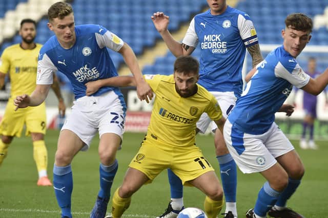Ethan Hamilton (left) and Harrison Burrows battle for possession for Posh against Burton. Photo: David Lowndes.