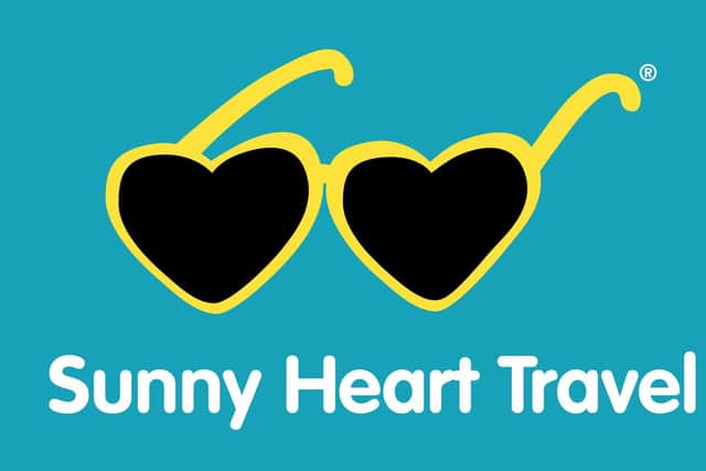 The logo of Sunny Heart Travel.