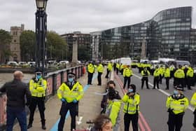 Police and protesters on Lambeth Bridge