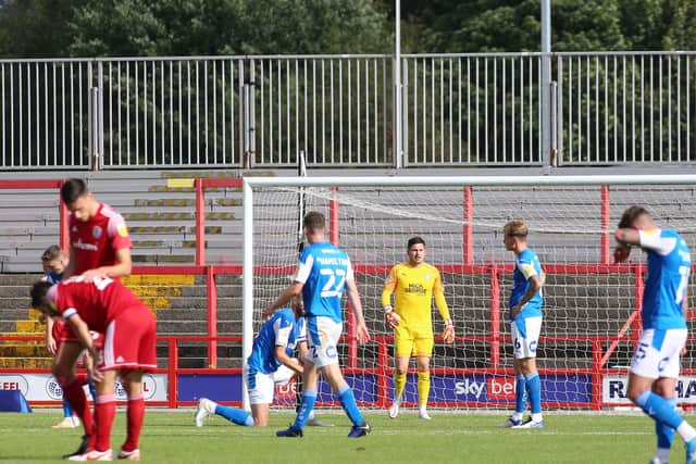Christy Pym of Peterborough United cuts a dejected figure after Accrington Stanley score the opening goal of the game. Photo: Joe Dent/theposh.com.