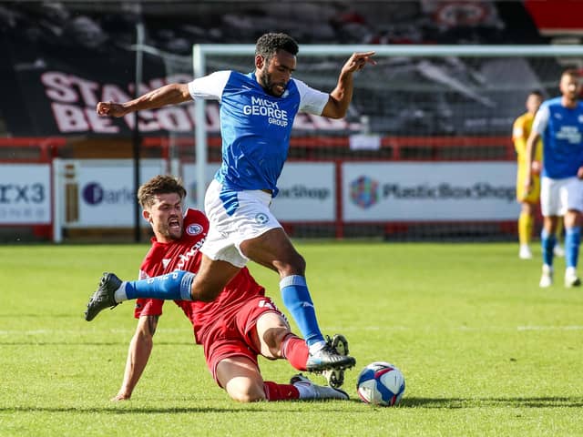 Posh man of the match Nathan Thompson in action with Cameron Burgess of Accrington Stanley. Photo: Joe Dent/theposh.com.