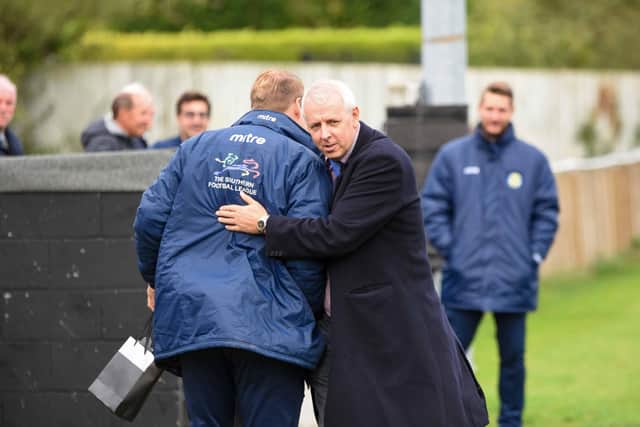Peterborough Sports chairman Grant Biddle (right) with manager Jimmy Dean.